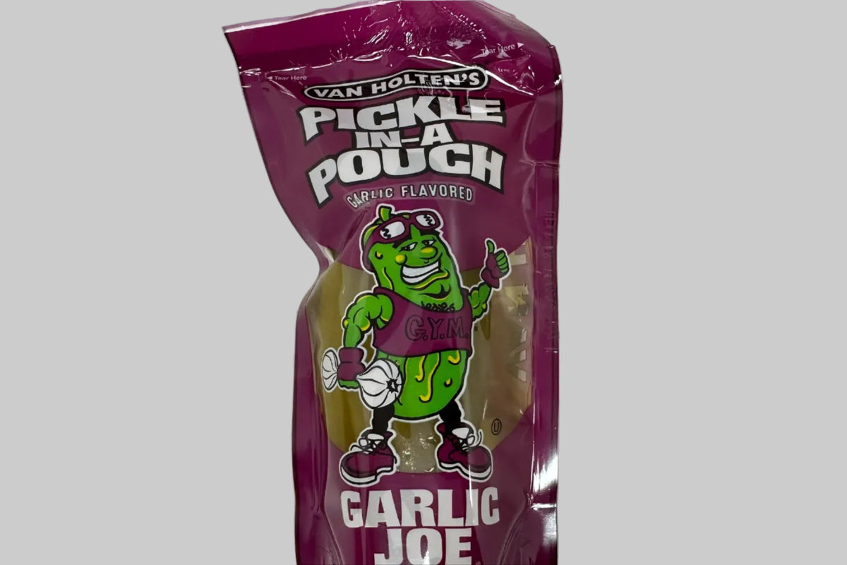 Purple package of Pickle Pouch Garlic flavor on a speckled surface